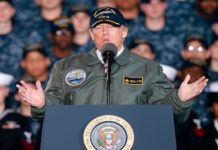 Trump talks tough on defense spending aboard the world’s most advanced combat ship
