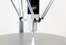 Additive manufacturing with liquid materials