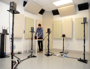 Brett Day, lab manager, makes final adjustments for Spirent's Amazon test lab.)