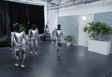 Tesla's Bot now pick up objects & move slowly
